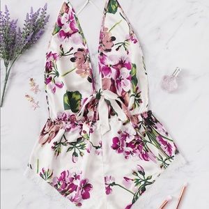 Floral backless bodysuit. Never worn!